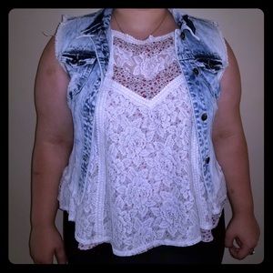 Bleached and ripped jean vest